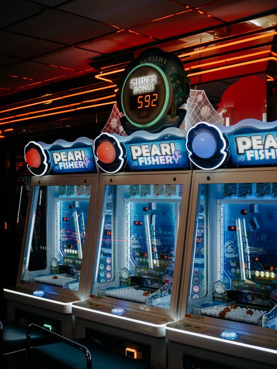 Illuminated arcade machines in a game center