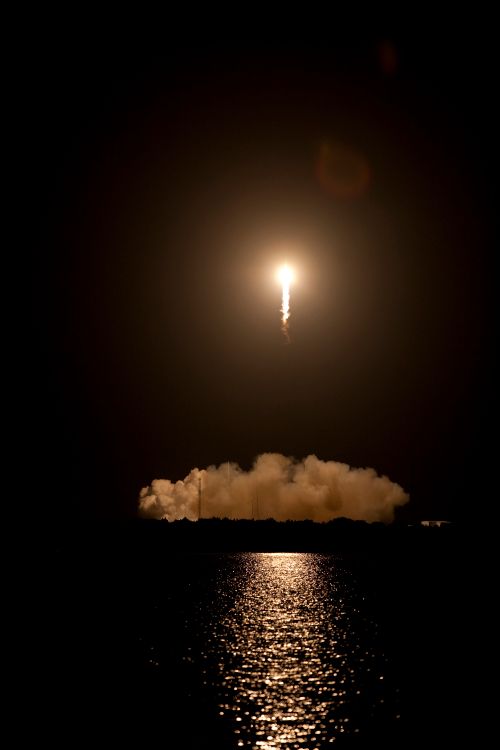 A rocket launching into the night sky
