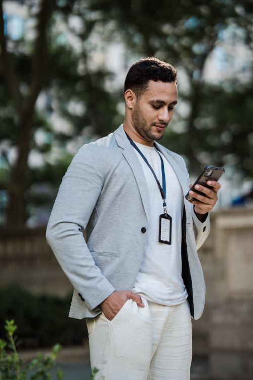 Identity badge and smartphone illustrating account verification